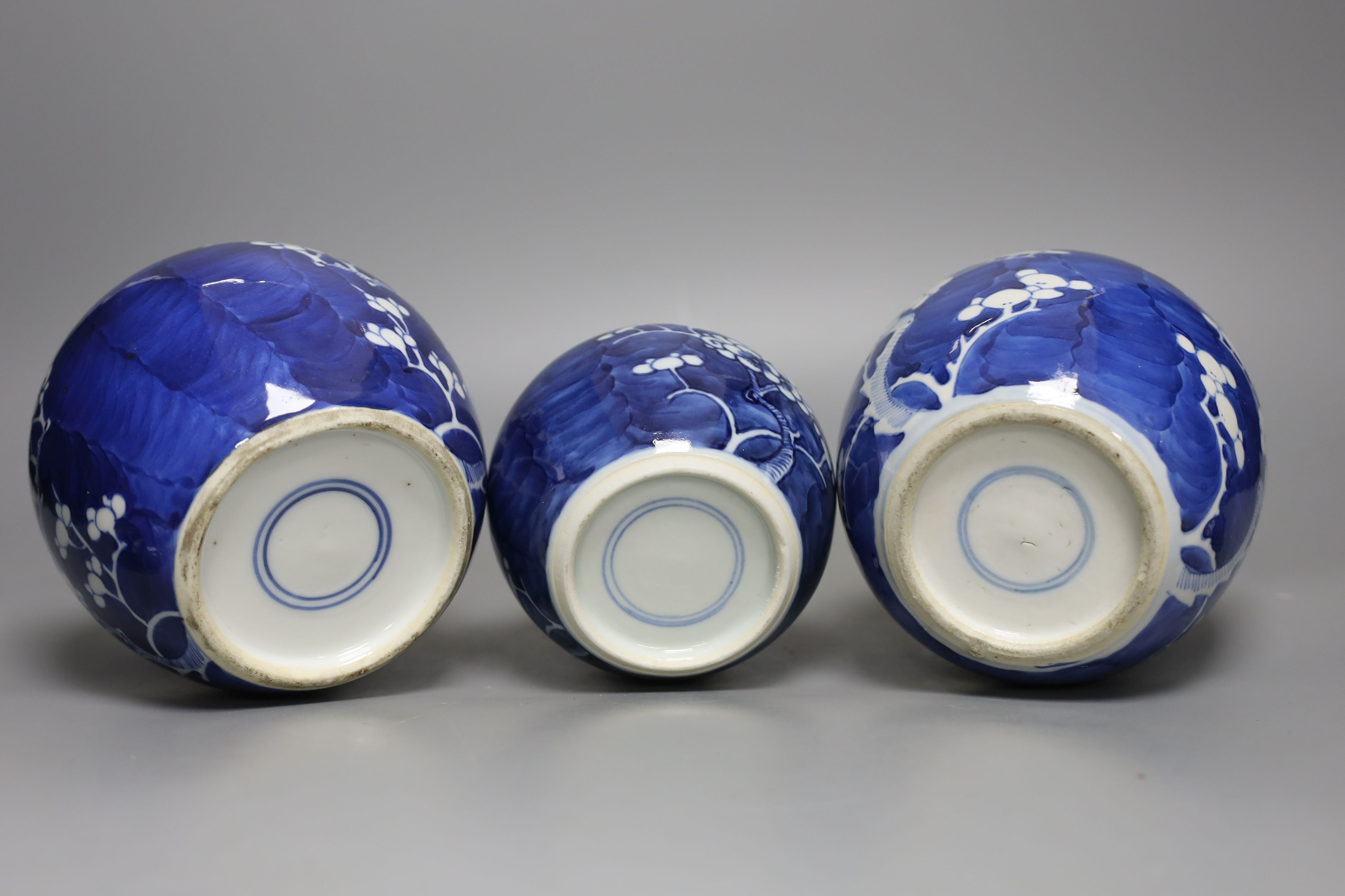 Three 19th century graduated Chinese blue and white ginger jars and covers